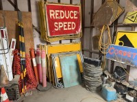 201 · Contents of room include road signs A-frame safety